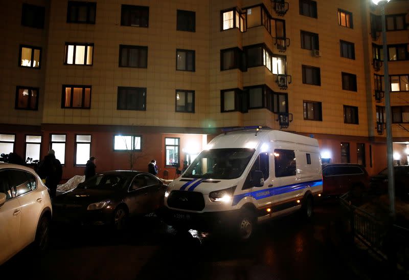 A police van is parked next to a building, where the apartment of Russian opposition leader Alexei Navalny is located, in Moscow