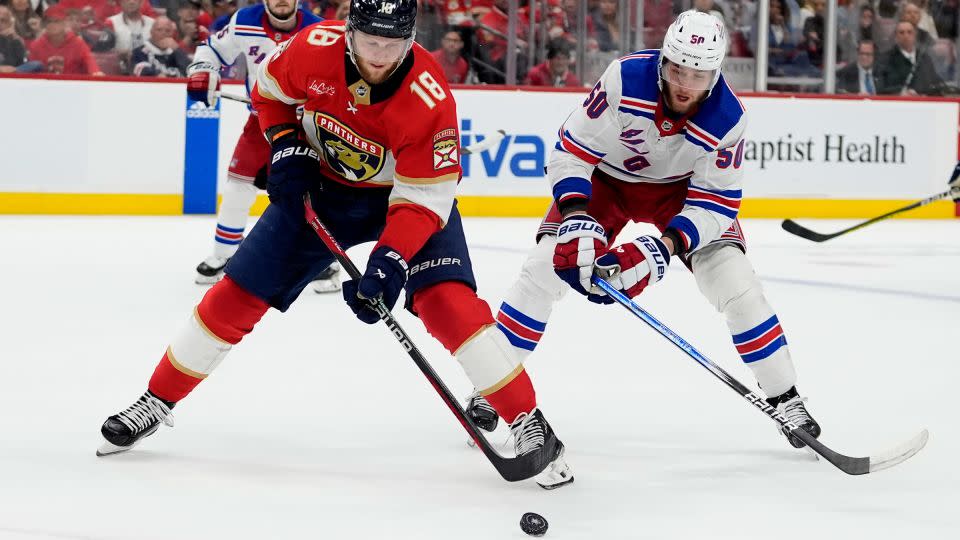 Florida Panthers center Steven Lorentz skates with the puck as New York Rangers left wing Will Cuylle defends during Game 6 in the Eastern Conference finals of the NHL hockey Stanley Cup playoffs in Sunrise, Florida on Saturday. - Lynne Sladky/AP