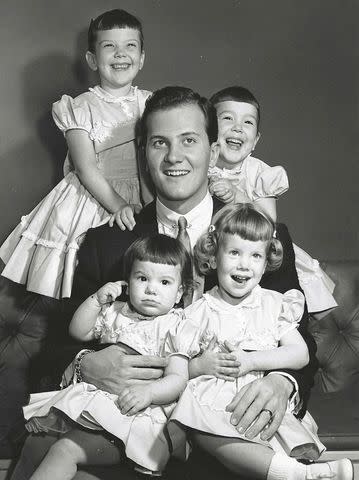 <p>Courtesy Lindy Boone</p> The Boone sisters with dad Pat as children