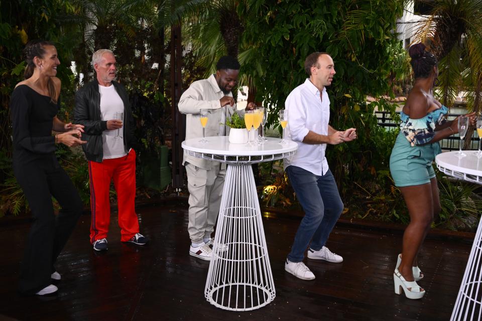 Chris Moyles watches Matt Hancock dance at the I'm a Celebrity... Get Me Out of Here! end of show party. (ITV/Shutterstock)