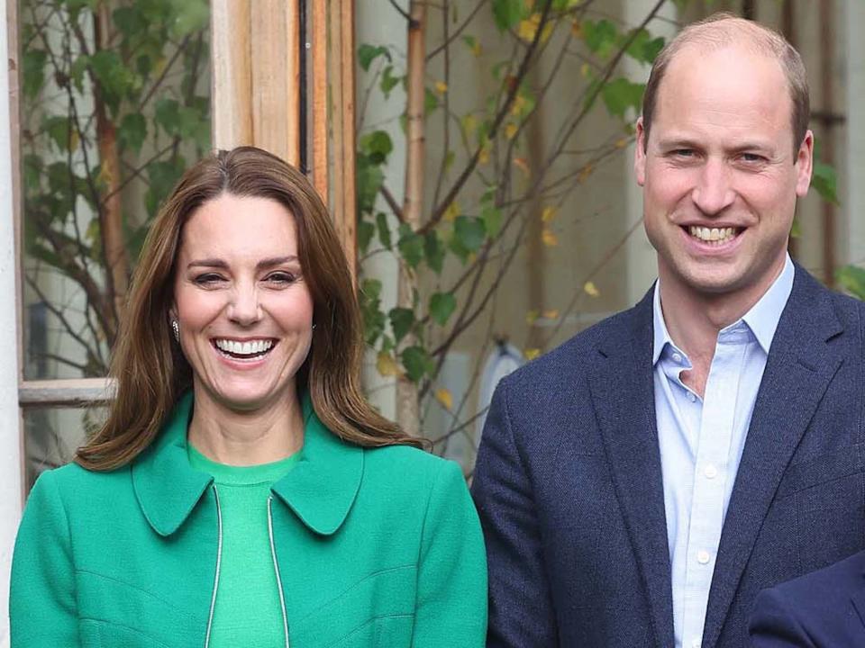 Prince William and Kate Middleton smile for a photo.