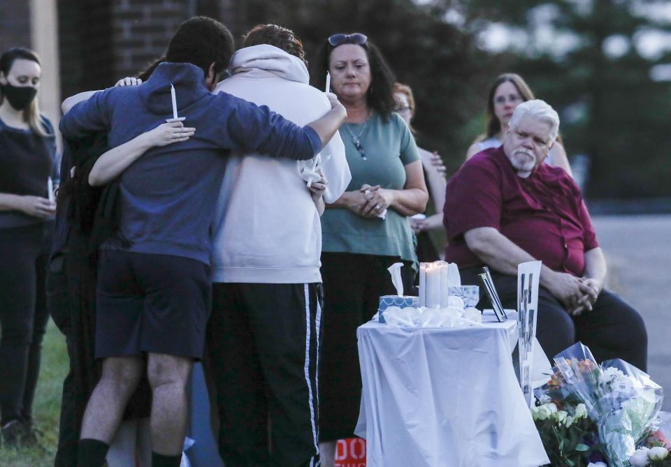 Friends and family of gather for a vigil for the Jackson family. 