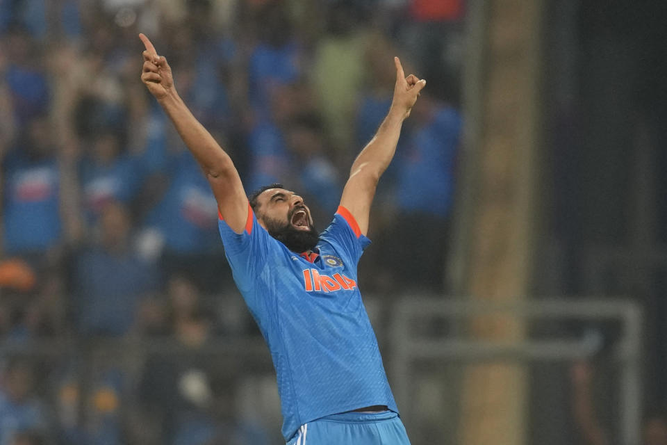 India's Mohammed Shami celebrates the wicket of New Zealand's Daryl Mitchell and also five wicket haul during the ICC Men's Cricket World Cup first semifinal match between India and New Zealand in Mumbai, India, Wednesday, Nov. 15, 2023. (AP Photo/Rafiq Maqbool)