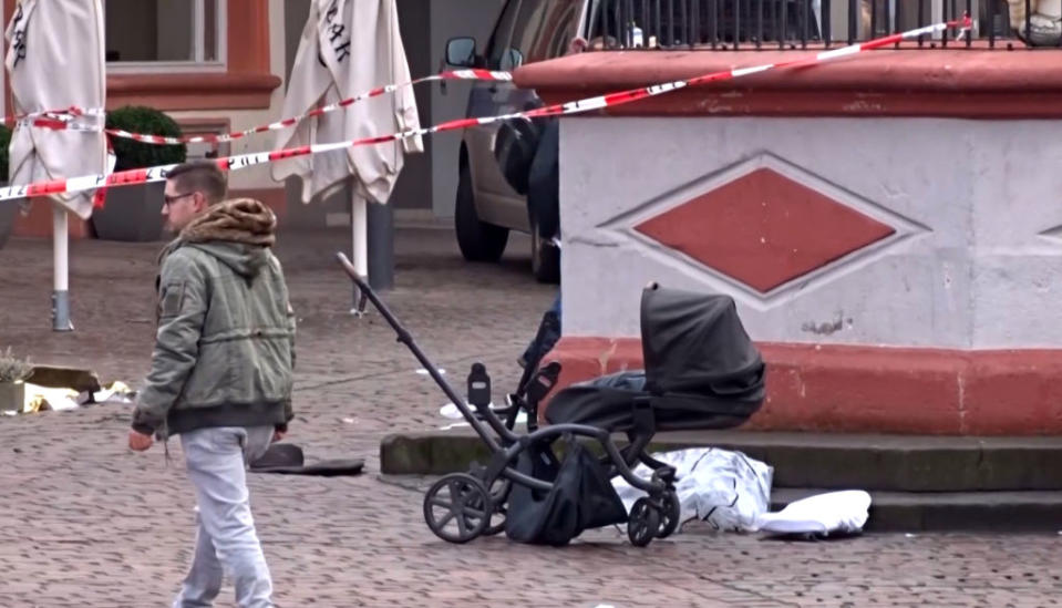 A cordoned-off area with a destroyed pram at one of the scenes where a car drove into pedestrians in the centre of Trier, Germany. 