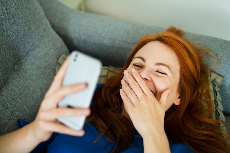 a woman holding a phone