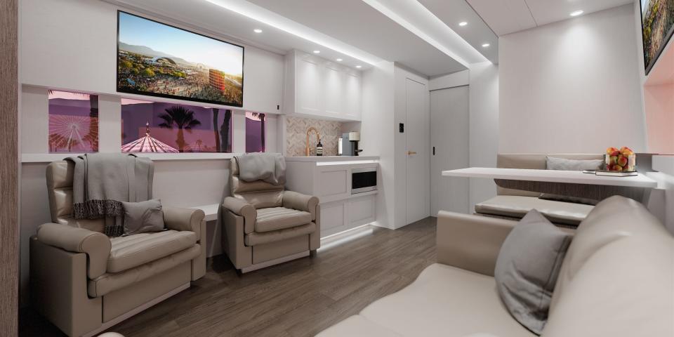 A rendering of what the bus' interior could look like shows plush lounge seating, a TV, and a small kitchen.