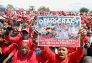 Mourners attend the funeral of Movement For Democratic Change (MDC) leader, Morgan Tsvangirai, in Buhera, Zimbabwe February 20, 2018. REUTERS/Philimon Bulawayo