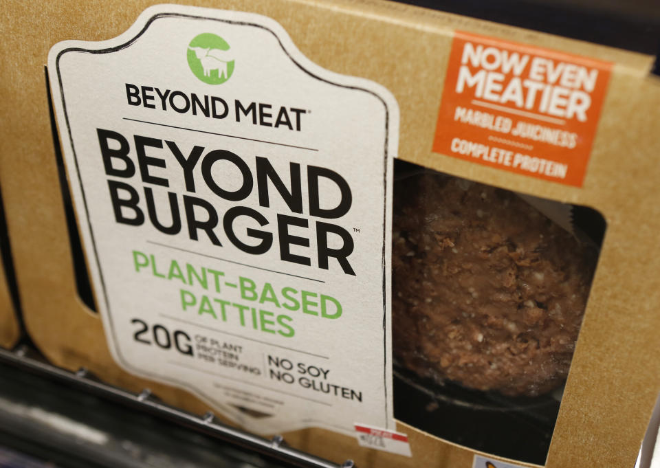 FILE - In this June 27, 2019, file photo a meatless burger patty called Beyond Burger made by Beyond Meat is displayed at a grocery store in Richmond, Va. PepsiCo is joining forces with Beyond Meat to develop new snacks and drinks made from plant-based proteins. The companies aren't yet saying what kinds of products they will make. (AP Photo/Steve Helber, File)