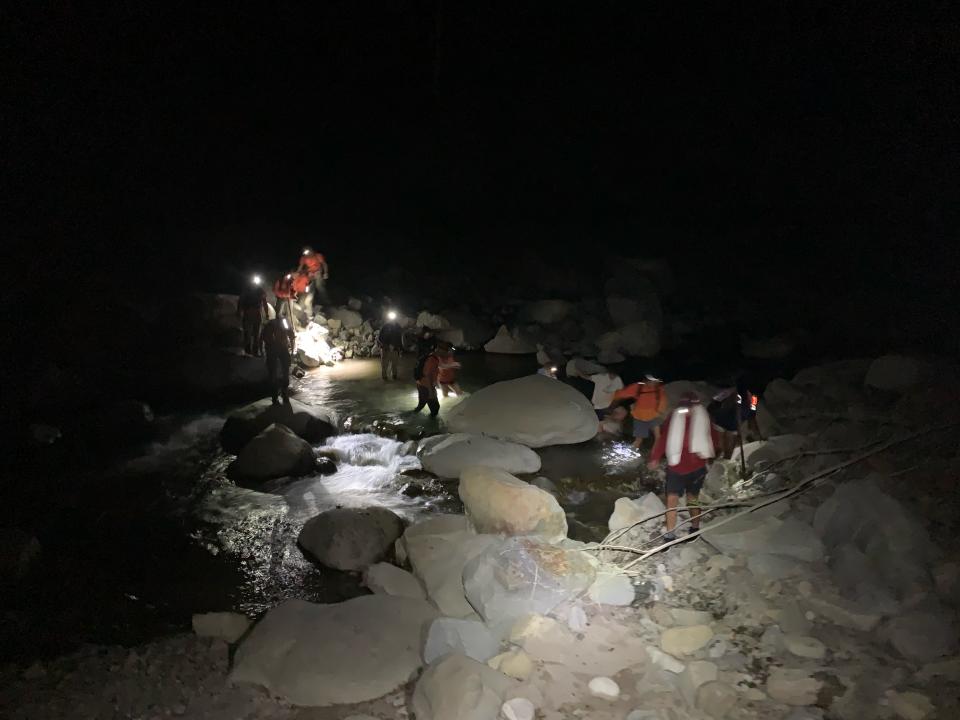 Ten teens were rescued from a remote canyon Friday night after requesting help using a new iPhone feature, sheriff's officials said.