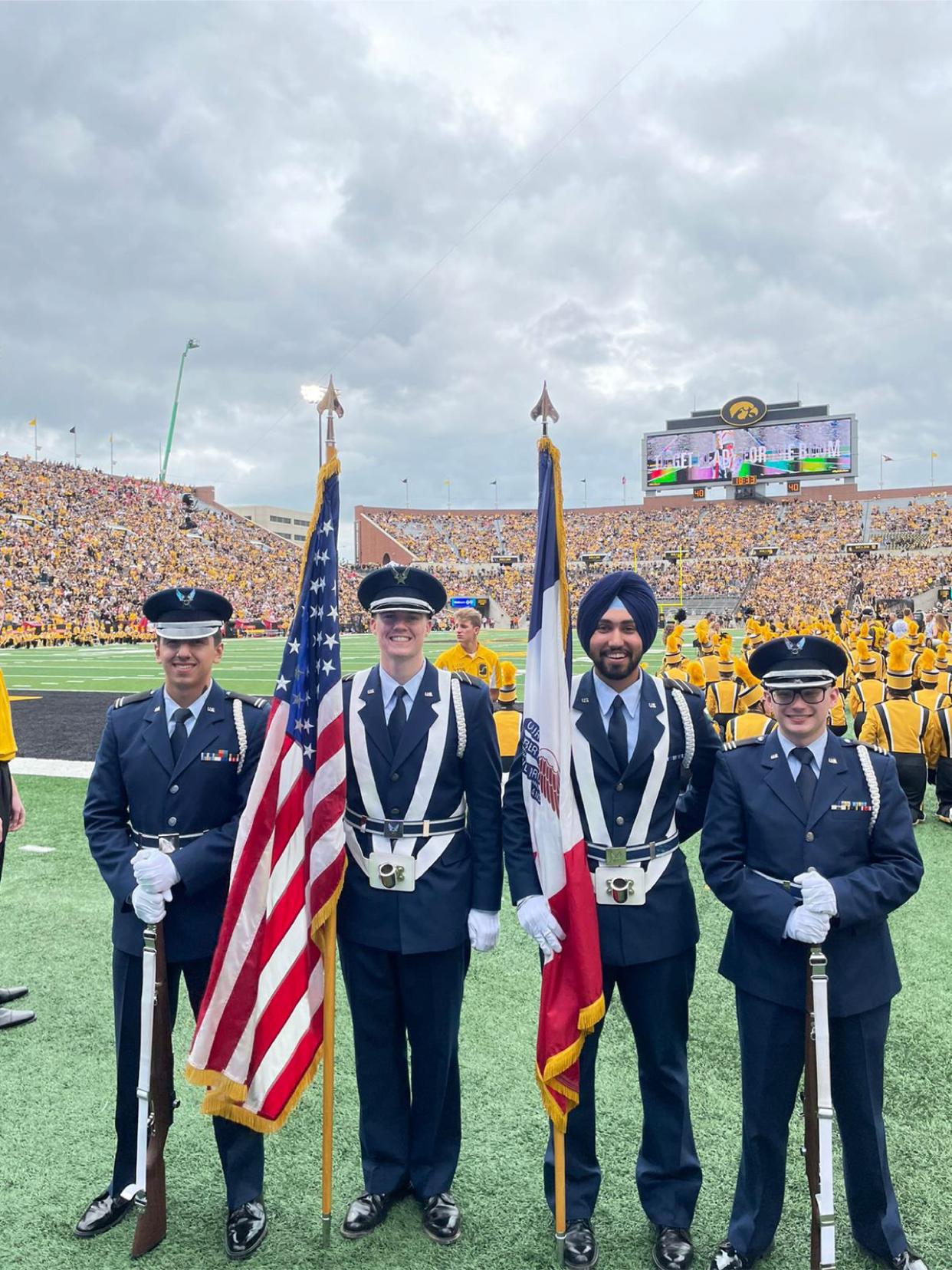 Air Force ROTC Cadet Gursharan Virk takes part in Detachment 255’s color guard at football game at the University of Iowa in 2021. Virk is the first Sikh ROTC cadet to be granted religious accommodations by the Air Force in observation of his faith. The accommodations include wear of a turban and facial hair.