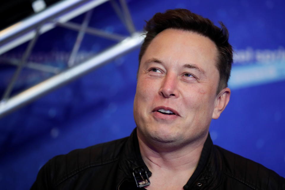 SpaceX owner and Tesla CEO Elon Musk looks on after arriving on the red carpet for the Axel Springer award, in Berlin, Germany, December 1, 2020. REUTERS/Hannibal Hanschke/Pool