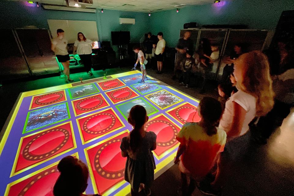 Children play a game on the sciPad at the Emerald Coast Science Center during a field trip Tuesday. The Emerald Coast Science Center was recently recognized by the Association of Science and Technology Centers for overcoming the many obstacles posed by the pandemic.