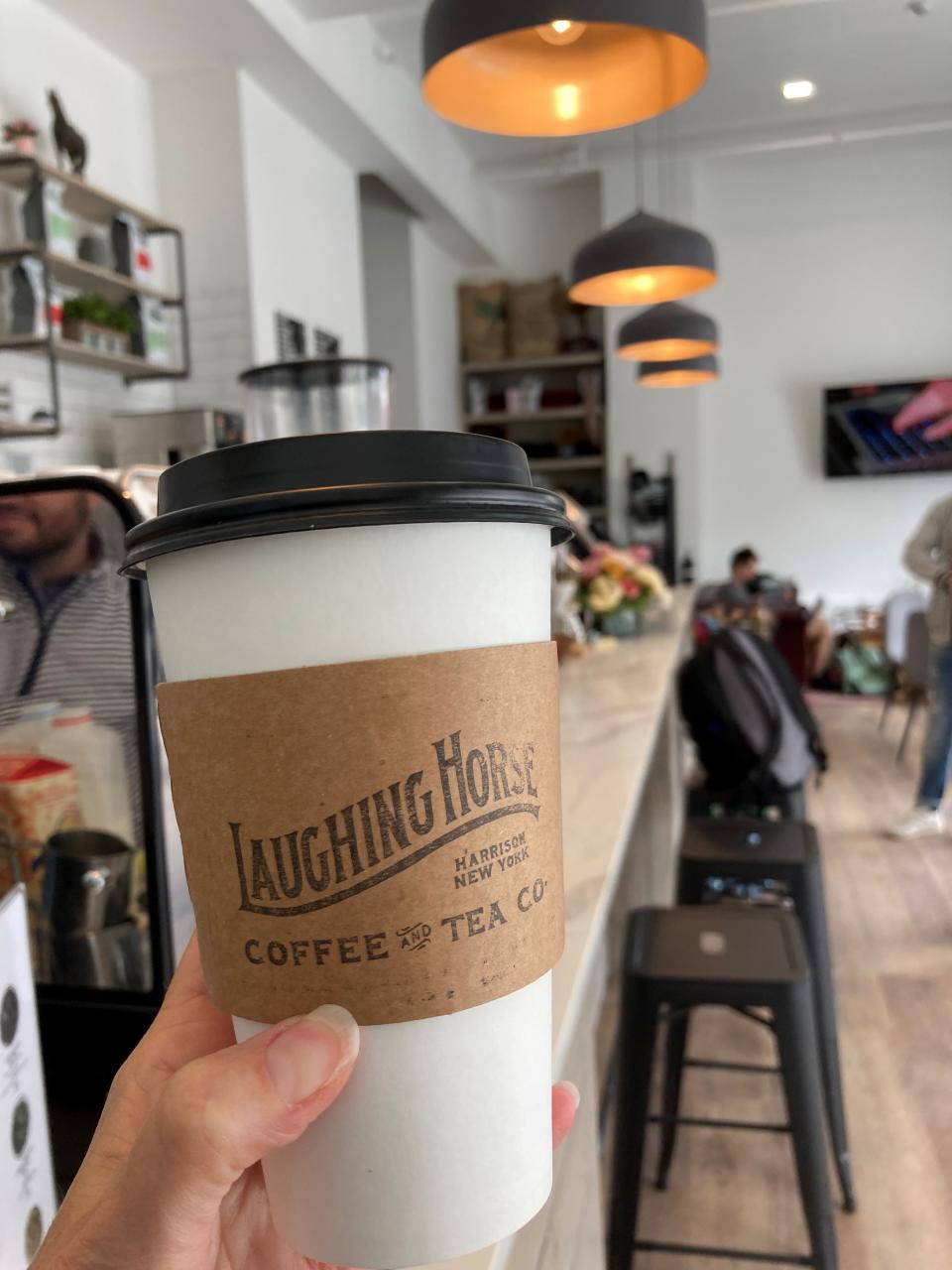 Latte from Laughing Horse Coffee & Tea in Harrison. Photographed May 11, 2022.