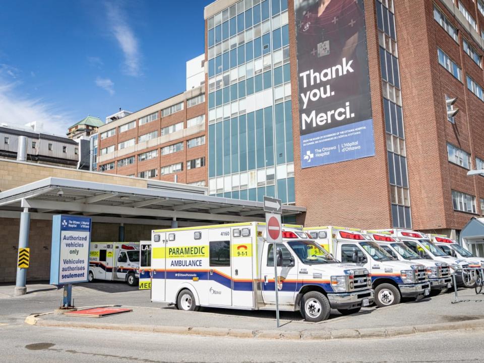 Ottawa Paramedic Services ambulances sit outside The Ottawa Hospital's Civic campus on April 12, 2021. (Brian Morris/CBC - image credit)