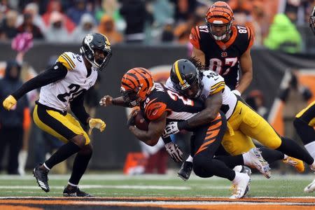 Oct 14, 2018; Cincinnati, OH, USA; Cincinnati Bengals running back Joe Mixon (28) is tackled by Pittsburgh Steelers linebacker Bud Dupree (48) in the second half at Paul Brown Stadium. Mandatory Credit: Aaron Doster-USA TODAY Sports