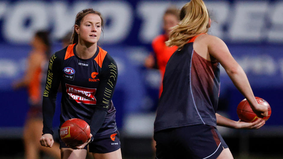 Nicola Barr completes a handpass during a GWS Giants training session.