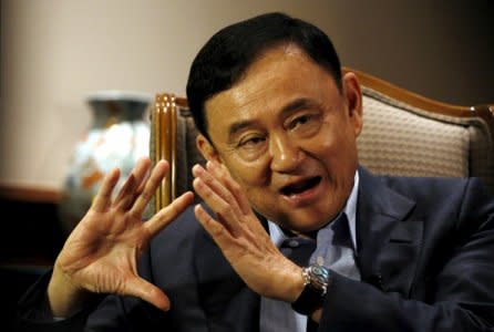 FILE PHOTO: Former Thai Prime Minister Thaksin Shinawatra speaks to Reuters during an interview in Singapore February 23, 2016. REUTERS/Edgar Su/File Photo