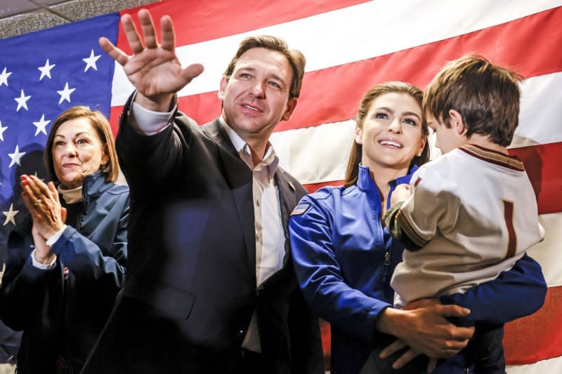 Florida Governor and Republican presidential candidate Ron DeSantis stands with his wife Casey, son Mason, and Iowa Governor Kim Reynolds (L) before speaking to supporters in West Des Moines, Iowa in January. Photo by Tannen Maury/UPI