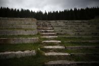 REFILE CORRECTING TYPO IN SARAJEVO A view of the spectator stands at the disused ski jump from the Sarajevo 1984 Winter Olympics on Mount Igman, near Sarajevo September 19, 2013. Abandoned and left to crumble into oblivion, most of the 1984 Winter Olympic venues in Bosnia's capital Sarajevo have been reduced to rubble by neglect as much as the 1990s conflict that tore apart the former Yugoslavia. The bobsleigh and luge track at Mount Trebevic, the Mount Igman ski jumping course and accompanying objects are now decomposing into obscurity. The bobsleigh and luge track, which was also used for World Cup competitions after the Olympics, became a Bosnian-Serb artillery stronghold during the war and is nowadays a target of frequent vandalism. The clock is now ticking towards the 2014 Winter Olympics, with October 29 marking 100 days to the opening of the Games in the Russian city of Sochi. Picture taken on September 19, 2013. REUTERS/Dado Ruvic (BOSNIA AND HERZEGOVINA - Tags: SOCIETY SPORT OLYMPICS SKIING) ATTENTION EDITORS: PICTURE 20 OF 23 FOR PACKAGE 'SARAJEVO'S WINTER OLYMPIC LEGACY'. TO FIND ALL IMAGES SEARCH 'DADO IGMAN'