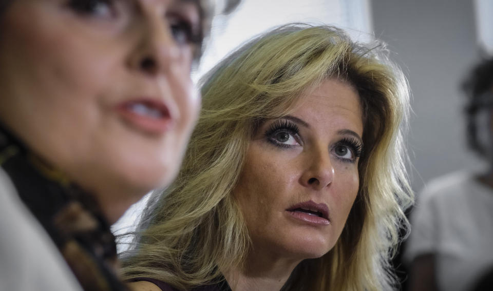 FILE - Summer Zervos, right, a former contestant on "The Apprentice" accusing Donald Trump of unwanted sexual contact, and her lawyer Gloria Allred, left, hold a news conference, Oct. 14, 2016, in Los Angeles. On Friday, Nov. 12, 2021, Zervos dropped her defamation lawsuit against former President Trump. (AP Photo/Ringo H.W. Chiu, File)