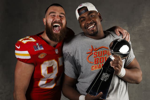 <p>Ryan Kang/Getty</p> Chris Jones #95 (R) and Travis Kelce #87 of the Kansas City Chiefs pose for a portrait with the Vince Lombardi Trophy