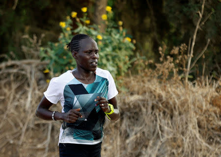 Lonah Chemtai, a Kenyan-born runner who will represent Israel in the women's marathon at the 2016 Rio Olympics trains with her husband and coach, Israeli Dan Salpeter, near their house in Moshav Yanuv, central Israel July 14, 2016. REUTERS/Baz Ratner