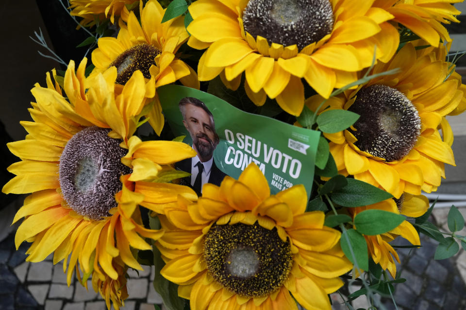 An election campaign leaflet with a picture of Socialist Party leader Pedro Nuno Santos and the words "Your vote counts" in left on a flower vase during a campaign action on the streets of Setubal, south of Lisbon, March 5, 2024. Portugal will hold a general election on March 10. (AP Photo/Armando Franca)