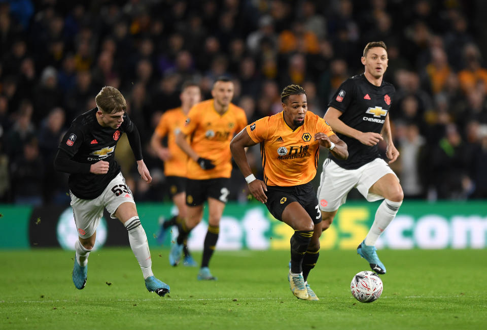 Adama Traore of Wolverhampton Wanderers breaks away from Brandon Williams. (Credit: Getty Images)