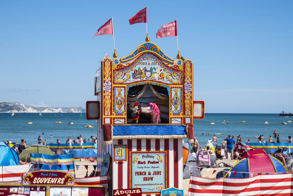 WEYMOUTH, UK - AUGUST 15TH 2017: A Punch and Judy show taking place on the beautiful Weymouth seafront in Dorset, UK, on 15th August 2017.