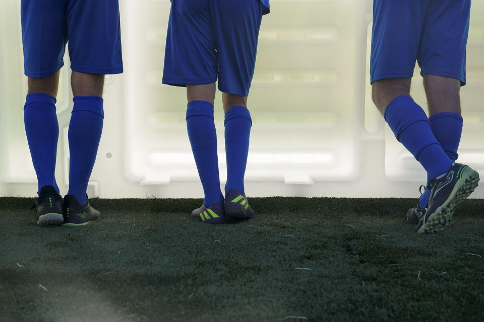 Italy players watch teammates play in a match at the Homeless World Cup, Tuesday, July 11, 2023, in Sacramento, Calif. (AP Photo/Godofredo A. Vásquez)