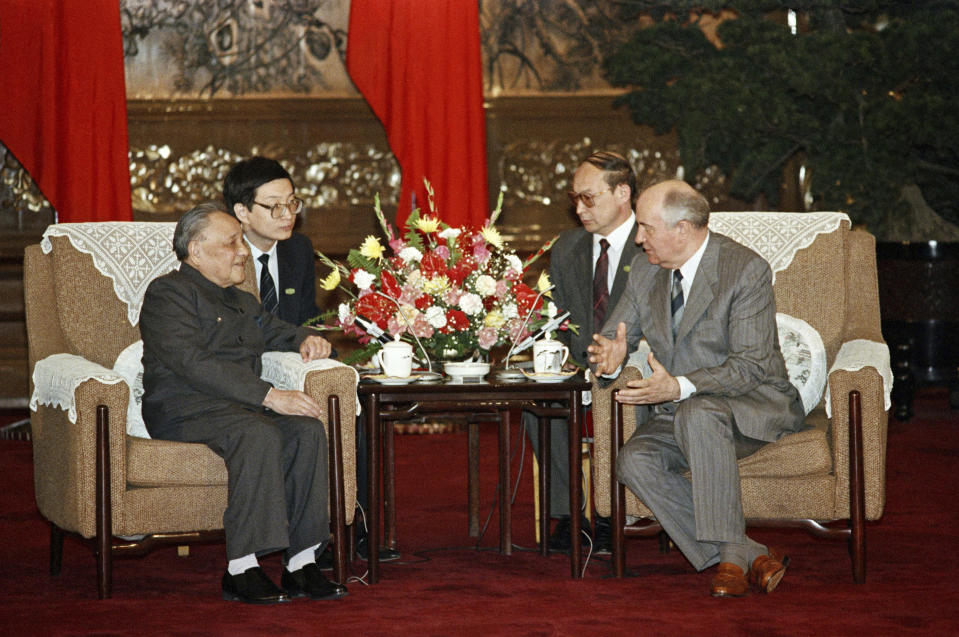 FILE - Soviet leader Mikhail Gorbachev, right, gestures as he talks with senior Chinese leader Deng Xiaoping during their meeting on May 16, 1989 at Beijing's Great Hall of the People. China’s leader Xi Jinping just concluded his three-day visit with Russian President Vladimir Putin, a warm affair in which the two men praised each other and spoke of a profound friendship. It’s a high in a complicated, centuries-long relationship in which the two countries have been allies and enemies. (AP Photo/Boris Yurchenko, File)