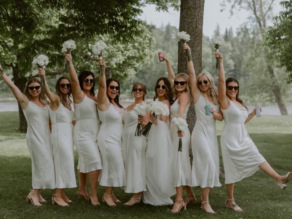 After two pandemic summers, business is brisker in the wedding industry in 2022, with celebrations such as the one featuring this wedding party in Thunder Bay, Ont. But some industry members worry the ramped-up business won't enough to recoup losses.  (Submitted by Kelly O'Brien - image credit)