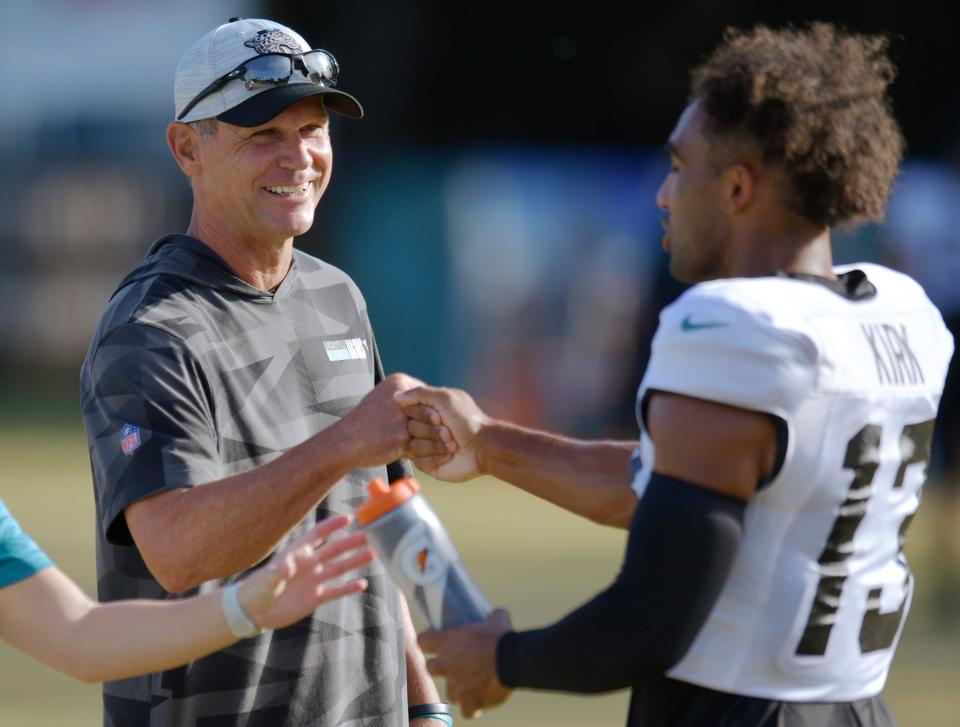 Jacksonville Jaguars General Manager Trent Baalke bumps fists with Jacksonville Jaguars wide receiver Christian Kirk (13) during Monday morning's training camp. The Jacksonville Jaguars held training camp Monday, August 1, 2022, at the Episcopal School of Jacksonville Knight Campus practice fields on Atlantic Blvd.