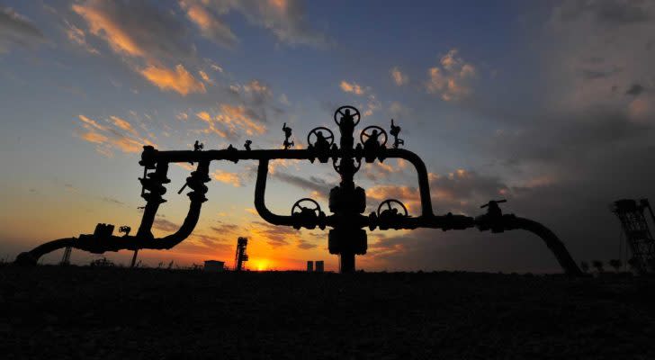 a gas pipe with the sun going down in the background, natural