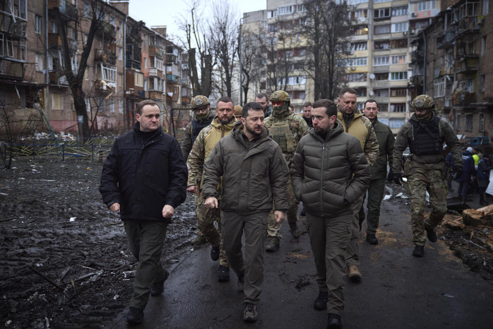 FILE - In this photo provided by the Ukrainian Presidential Press Office on Friday, Nov. 25, 2022, Ukrainian President Volodymyr Zelenskyy inspects damaged buildings as he visits town of Vyshgorod outside the capital Kyiv. Ukrainian President Volodymyr Zelenskyy said that multiples waves of Russian strikes have destroyed half of Ukraine's infrastructure, urging the U.S. and other Western allies to quickly provide more air defense weapons to fend off the Russian attacks. (Ukrainian Presidential Press Office via AP, File)