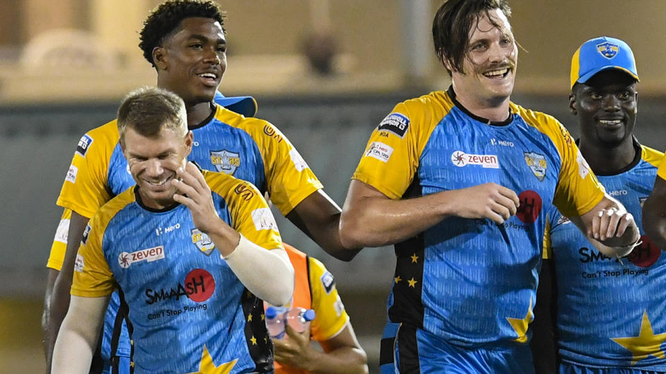 David Warner (L), Obed McCoy (2L), Mitchell McClenaghan (2R) and Andre Fletcher (R) of St Lucia Stars during match 10 of the Hero Caribbean Premier League. (Photo by Randy Brooks – CPL T20/Getty Images)