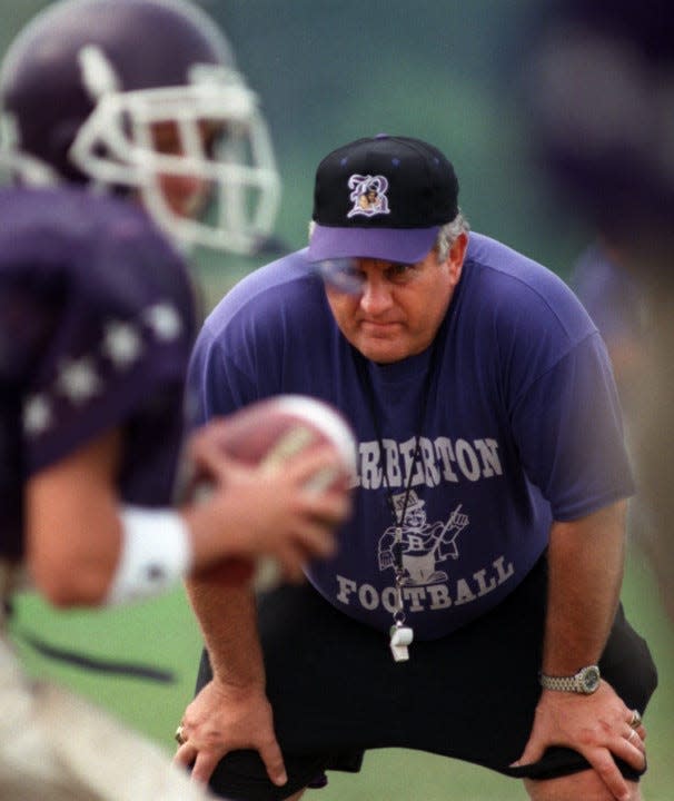 Tim Flossie works with the Barberton High School football team in an undated photo.