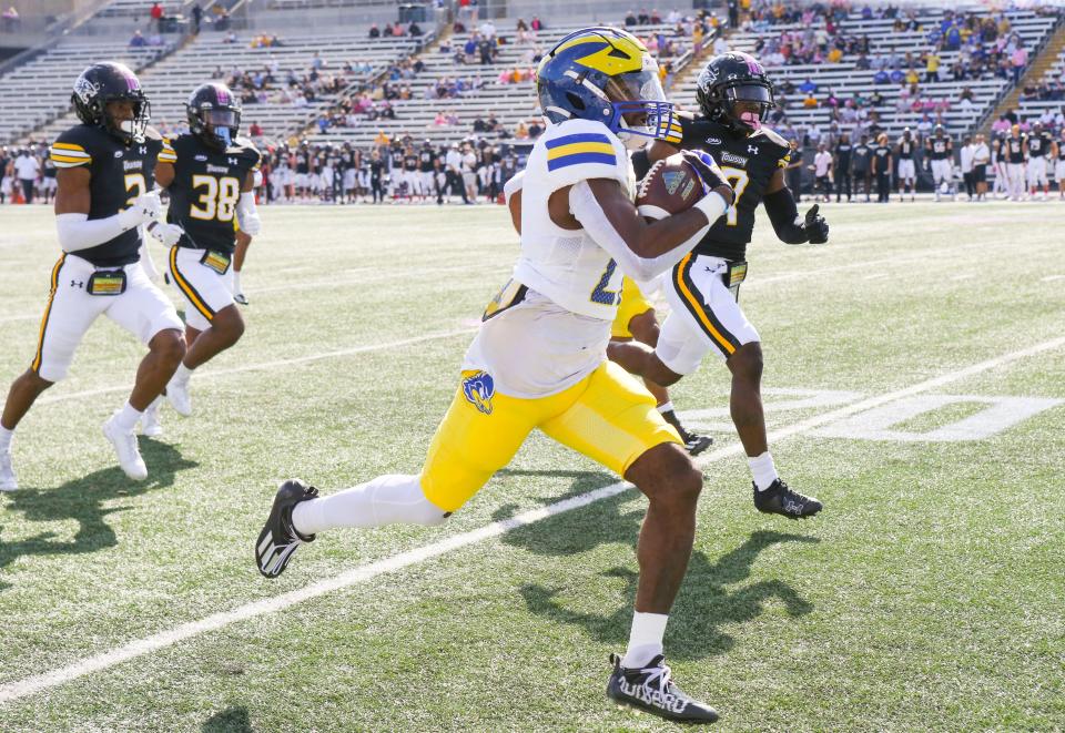 Delaware running back Marcus Yarns stays ahead of the Towson defense as he scores on the Hens' first play from scrimmage at Johnny Unitas Stadium in Towson, Md., Saturday, Oct. 28, 2023.