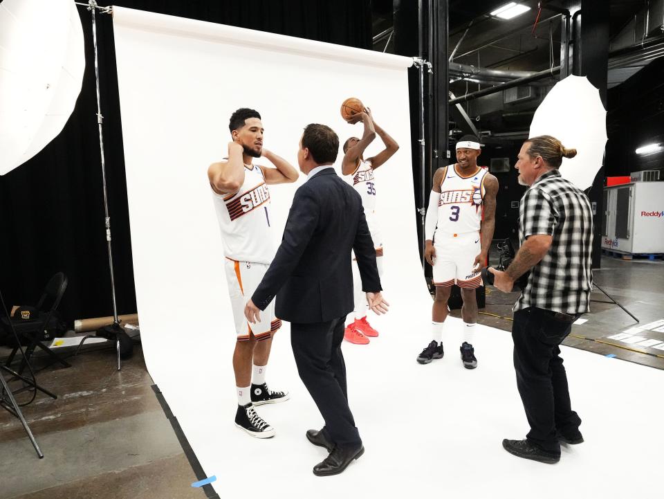 Phoenix Suns owner Mat Ishbia poses with guard Devin Booker, forward Kevin Durant, and guard Bradley Beal during media day at Footprint Center in Phoenix on Oct. 2, 2023.