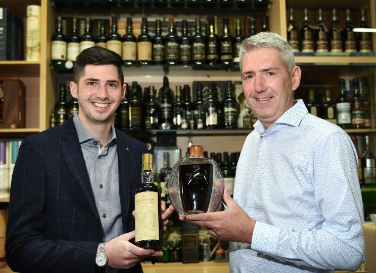 Harrison and Wayne Ormerod of Whisky Online Auctions with their record breaking bottle of whisky (Blackpool Gazette/SWNS)