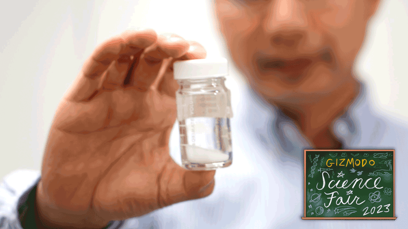 A scientist holds a vial of white paint. Purdue University researchers created paint that reflects 98% of light.