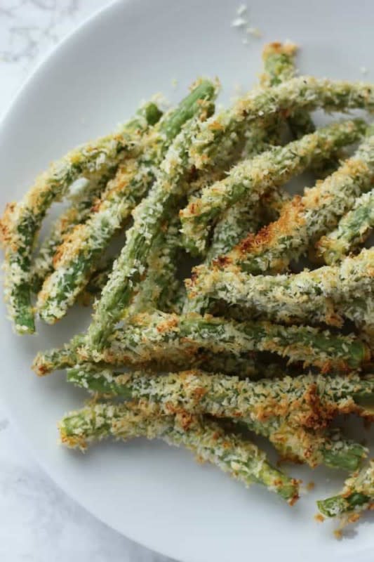 <p>I Heart Vegetables</p><p>These crispy crunchy green bean fries are baked in the oven so they’re a perfect healthy side dish! Pair them with your favorite veggie burger for an easy dinner!</p><p><strong>Get the Recipe: </strong><a href="https://iheartvegetables.com/crispy-oven-baked-green-bean-fries/" rel="nofollow noopener" target="_blank" data-ylk="slk:Crispy Green Beans;elm:context_link;itc:0;sec:content-canvas" class="link "><strong>Crispy Green Beans</strong></a></p>