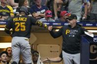 Pittsburgh Pirates' Gregory Polanco is congratulated after hitting a home run during the sixth inning of a baseball game against the Milwaukee Brewers Friday, June 11, 2021, in Milwaukee. (AP Photo/Morry Gash)