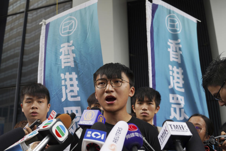 Issac Cheng, vice-chairperson of Demosisto, speaks to reporters in Hong Kong Friday, Aug. 30, 2019. Demosisto, a pro-democracy group in Hong Kong, posted on its social media accounts that well-known activist Wong had been pushed into a private car around 7:30 a.m. Friday, Aug. 30, 2019 and was taken to police headquarters. It later said another member, Agnes Chow, had also been arrested, at her home. (AP Photo/Vincent Yu)