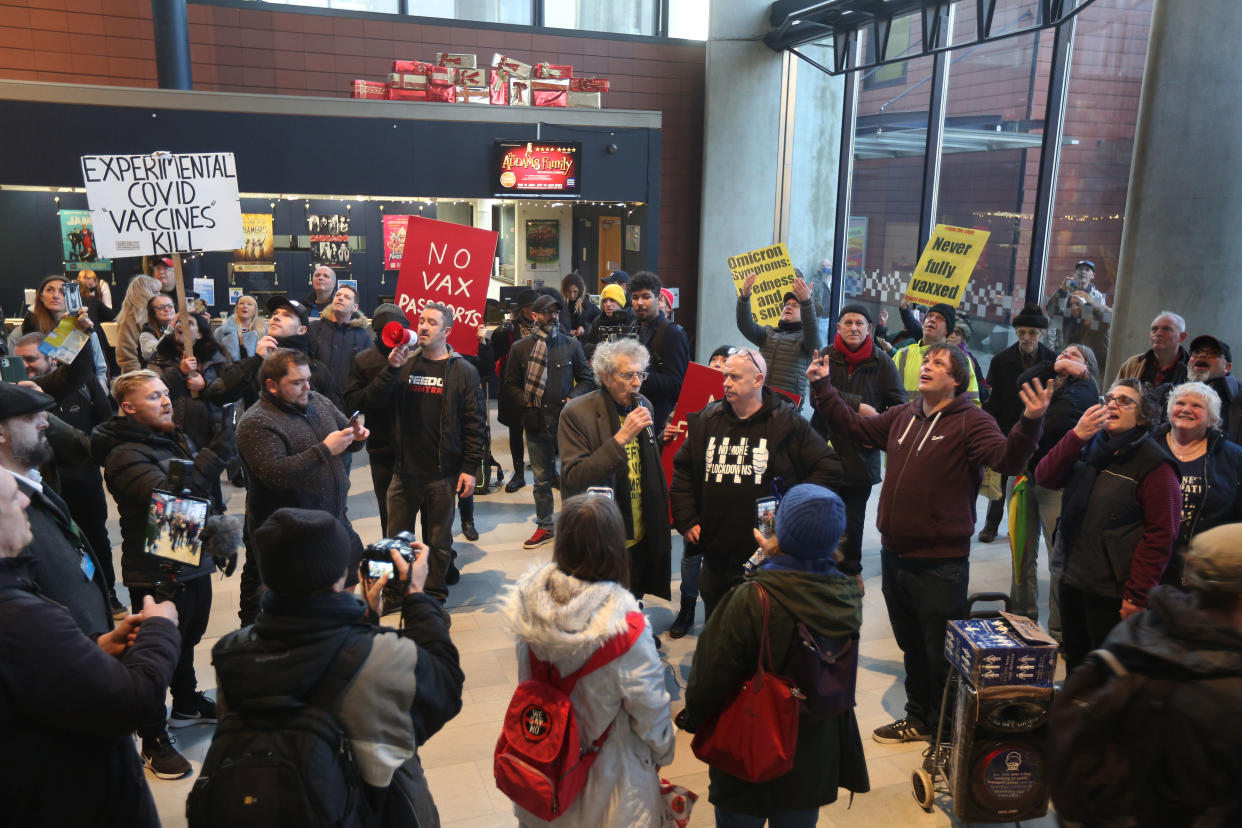 MILTON KEYNES, ENGLAND - DECEMBER 29: Piers Corbyn speaks as protesters forcibly enter the theatre to protest against cashless transactions and vaccine passports joined by Piers Corbyn on December 29, 2021 in Milton Keynes, England. Protesters are demonstrating against further Covid restrictions and perceived medical apartheid with a march to Milton Keynes main shopping centre. (Photo by Martin Pope/Getty Images)