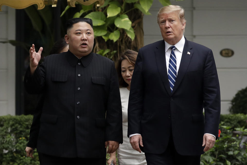 FILE - In this Feb. 28, 2019, file photo, North Korean leader Kim Jong Un, left, and U.S. President Donald Trump take a walk after their first meeting at the Sofitel Legend Metropole Hanoi hotel in Hanoi. Two months after he failed to win a badly needed easing of sanctions from Trump, Kim is traveling to Russia in a possible attempt to win its help as the U.S.-led trade sanctions hurt his country’s already-struggling economy. (AP Photo/Evan Vucci, File)