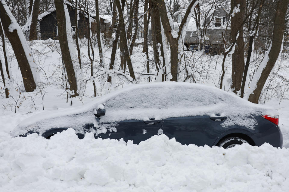 A car still covered in snow after a winter storm rolled through Western New York Tuesday, Dec. 27, 2022, in Amherst N.Y. (AP Photo/Jeffrey T. Barnes)