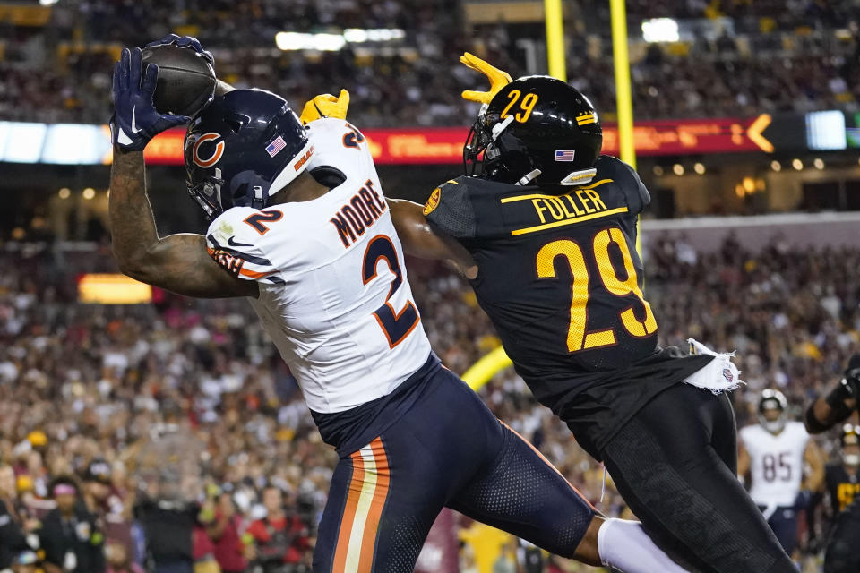 Chicago Bears wide receiver DJ Moore (2) making a touchdown catch against Washington Commanders cornerback Kendall Fuller (29) during the first half of an NFL football game, Thursday, Oct. 5, 2023, in Landover, Md. (AP Photo/Alex Brandon)