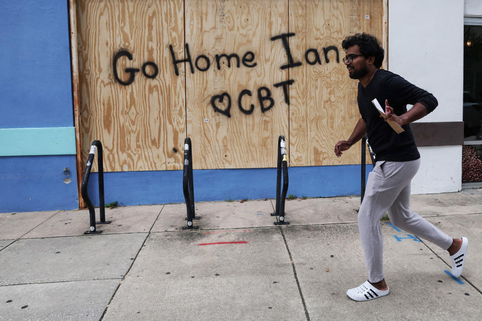 Spray paint on boards reads "Go Home Ian" and "♥ CBT"