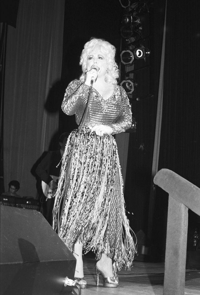 country musician and vocalist dolly parton performing at the new york hospital cornell medical center benefit held at the waldorf astoria on march 3, 1985 photo by fairchild archivepenske media via getty images